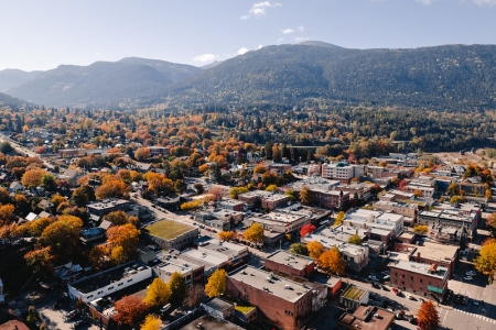 Aerial view of downtown Nelson, BC vibrant with fall colours.