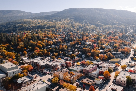 An aerial view of Nelson, BC with vibrant fall colours