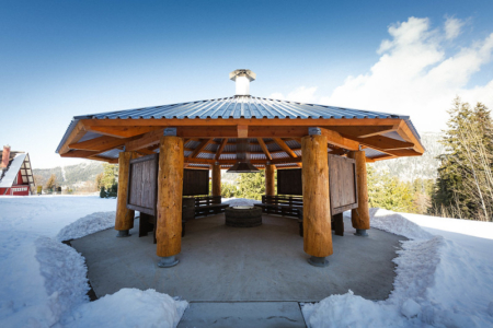 The gathering space build from large wood rounds at Selkirk College 10th Street Campus.
