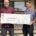Matt Popp (left) provides a donation to the local KidSport group.