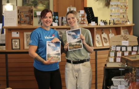 NKLT visitor guide and Nelson Visitor Centre staff